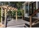 Outdoor deck with a pergola covering a grill, a wooden railing, and stairs leading to a backyard at 4086 Haverhill Dr, Atlanta, GA 30342