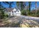 Charming two-story home with a manicured lawn, a basketball hoop and an attached two-car garage at 4086 Haverhill Dr, Atlanta, GA 30342