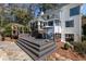 Back exterior view of home with deck, pergola, patio set and stone walkway at 4086 Haverhill Dr, Atlanta, GA 30342