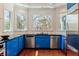 Modern kitchen with blue cabinets, stainless steel appliances and a garden window at 4086 Haverhill Dr, Atlanta, GA 30342