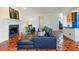 Living room with fireplace, tile floors and view into kitchen at 4086 Haverhill Dr, Atlanta, GA 30342