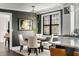 Stylish dining area featuring neutral tones, a modern chandelier, and an adjacent kitchen with ample natural light at , Tucker, GA 30084