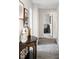 Hallway featuring carpet floor, modern decor table, and view of open doorway at , Tucker, GA 30084