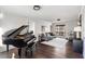 Elegant living room featuring a grand piano, hardwood floors, and ample natural light from a window at , Tucker, GA 30084