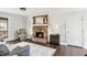 Comfortable living room featuring a stone fireplace, hardwood floors, and a neutral color scheme at , Tucker, GA 30084