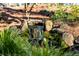 Backyard rock waterfall feature surrounded by mossy stones and lush foliage at , Tucker, GA 30084