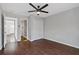 Bedroom with hardwood floors and access to a closet and hallway at 1664 Columbia Dr, Decatur, GA 30032