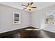 Bright bedroom with hardwood floors and two windows at 1664 Columbia Dr, Decatur, GA 30032