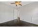 Well-lit bedroom with dark hardwood floors and access to another room at 1664 Columbia Dr, Decatur, GA 30032