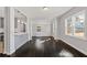 Bright dining area with dark hardwood floors and built-in bench at 1664 Columbia Dr, Decatur, GA 30032