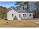 Charming renovated home with white siding and a spacious lawn at 1664 Columbia Dr, Decatur, GA 30032