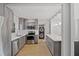 Updated kitchen featuring stainless steel appliances and gray cabinets at 1664 Columbia Dr, Decatur, GA 30032