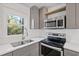 Modern kitchen with stainless steel appliances and white subway tile at 1664 Columbia Dr, Decatur, GA 30032