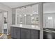 Modern kitchen island with white quartz countertop and gray cabinets at 1664 Columbia Dr, Decatur, GA 30032