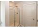 Bathroom features a shower with glass doors and bright lighting, offering a clean and modern space at 3573 Stonebranch Ln, Loganville, GA 30052