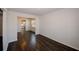 Open-concept living space featuring dark hardwood flooring and neutral wall color at 3573 Stonebranch Ln, Loganville, GA 30052