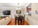 Bright dining area with hardwood floors and a view into the kitchen at 4701 Wehunt Se Trl, Smyrna, GA 30082