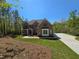 Lovely two-story brick home with a welcoming covered porch, set amidst a green lawn and a private driveway at 7449 Waterview Cv, Douglasville, GA 30135