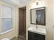 Bathroom featuring natural light, a walk-in shower, and dark vanity cabinets for a modern appeal at 951 Glenwood Se Ave # 1201, Atlanta, GA 30316