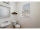 A bright powder room features a decorative mirror and natural light at 951 Glenwood Se Ave # 1201, Atlanta, GA 30316