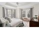 Sunlit main bedroom with neutral decor, comfortable bedding, and large windows at 951 Glenwood Se Ave # 1201, Atlanta, GA 30316