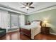 Spacious bedroom with hardwood floors and ceiling fan at 201 Little River Way, Woodstock, GA 30188