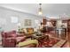 Bright living room with hardwood floors and comfy seating at 201 Little River Way, Woodstock, GA 30188