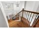 Beautiful staircase with hardwood steps and decorative iron railings leading to the upper level at 5575 Twelve Oaks Dr, Cumming, GA 30028