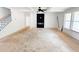 Spacious living room featuring a modern fireplace, white walls and a large picture window at 1275 Pj East Rd, Covington, GA 30014