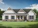 Charming one-story house with gray siding, brick accents, and a covered porch at 1275 Pj East Rd, Covington, GA 30014