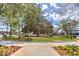 Quaint town square with large trees, manicured grass, and benches at 1275 Pj East Rd, Covington, GA 30014