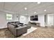 Spacious basement lounge with sectional sofa and fireplace at 496 Longview Dr, Norcross, GA 30071