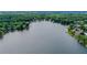 Aerial view of lakefront homes and lush green landscape at 1215 Wynridge Xing, Alpharetta, GA 30005