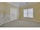 Bright bedroom with painted walls, window with blinds, double doors, and garden mural at 1215 Wynridge Xing, Alpharetta, GA 30005