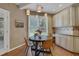 Charming breakfast nook with round table and pendant lighting at 1215 Wynridge Xing, Alpharetta, GA 30005