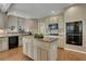 Modern kitchen with island, stainless steel appliances, and hardwood floors at 1215 Wynridge Xing, Alpharetta, GA 30005