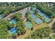 Aerial view of community tennis courts, surrounded by lush greenery at 1215 Wynridge Xing, Alpharetta, GA 30005