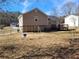 Large backyard with swing set and view of house at 2043 Laird Rd, Hiram, GA 30141