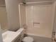 Clean bathroom with a tub, toilet and modern vanity at 2043 Laird Rd, Hiram, GA 30141