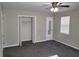 Bright bedroom featuring a large closet and ceiling fan at 2043 Laird Rd, Hiram, GA 30141