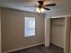 Bedroom with ceiling fan, window, and closet at 2043 Laird Rd, Hiram, GA 30141