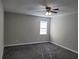 Well-lit bedroom with ceiling fan and carpeted floor at 2043 Laird Rd, Hiram, GA 30141