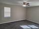 Spacious bedroom with ceiling fan and neutral wall paint at 2043 Laird Rd, Hiram, GA 30141