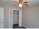 Bedroom with ceiling fan, closet and grey carpeting at 2043 Laird Rd, Hiram, GA 30141