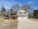 Tan house with 2 car garage and a large yard at 2043 Laird Rd, Hiram, GA 30141