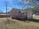 Exterior view of a house with a deck and yard at 2043 Laird Rd, Hiram, GA 30141