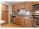 Well-equipped kitchen with wood cabinets and granite countertops at 2657 Lenox Ne Rd # 79, Atlanta, GA 30324