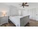 Bedroom with white wooden bed frame and hardwood floors at 4392 Overlook Dr, Acworth, GA 30101