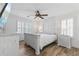 Bedroom with white wooden bed frame and hardwood floors at 4392 Overlook Dr, Acworth, GA 30101