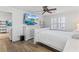 Bedroom with white wooden bed frame and hardwood floors at 4392 Overlook Dr, Acworth, GA 30101